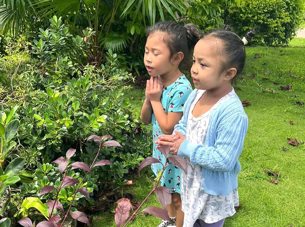 As part of their service activities to mark the five-year anniversary of Mercy Education, children at Infant of Prague Catholic Nursery and Kindergarten in Mangilao, Guam, pray for different intentions. (Courtesy of Mercy Education)