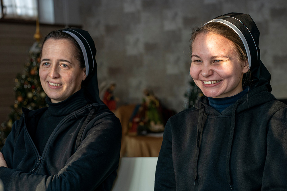 Sr. Veronika Yaniv, left, and Sr. Josafata Zapotichna speak of the challenges of the year since Russia's invasion of Ukraine. In caring for people displaced from eastern Ukraine, they say they have created "a peace village" within their monastery. "Behind these stories, you can see how this war seeps into people's lives," Zapotichna said. (GSR photo/Gregg Brekke)
