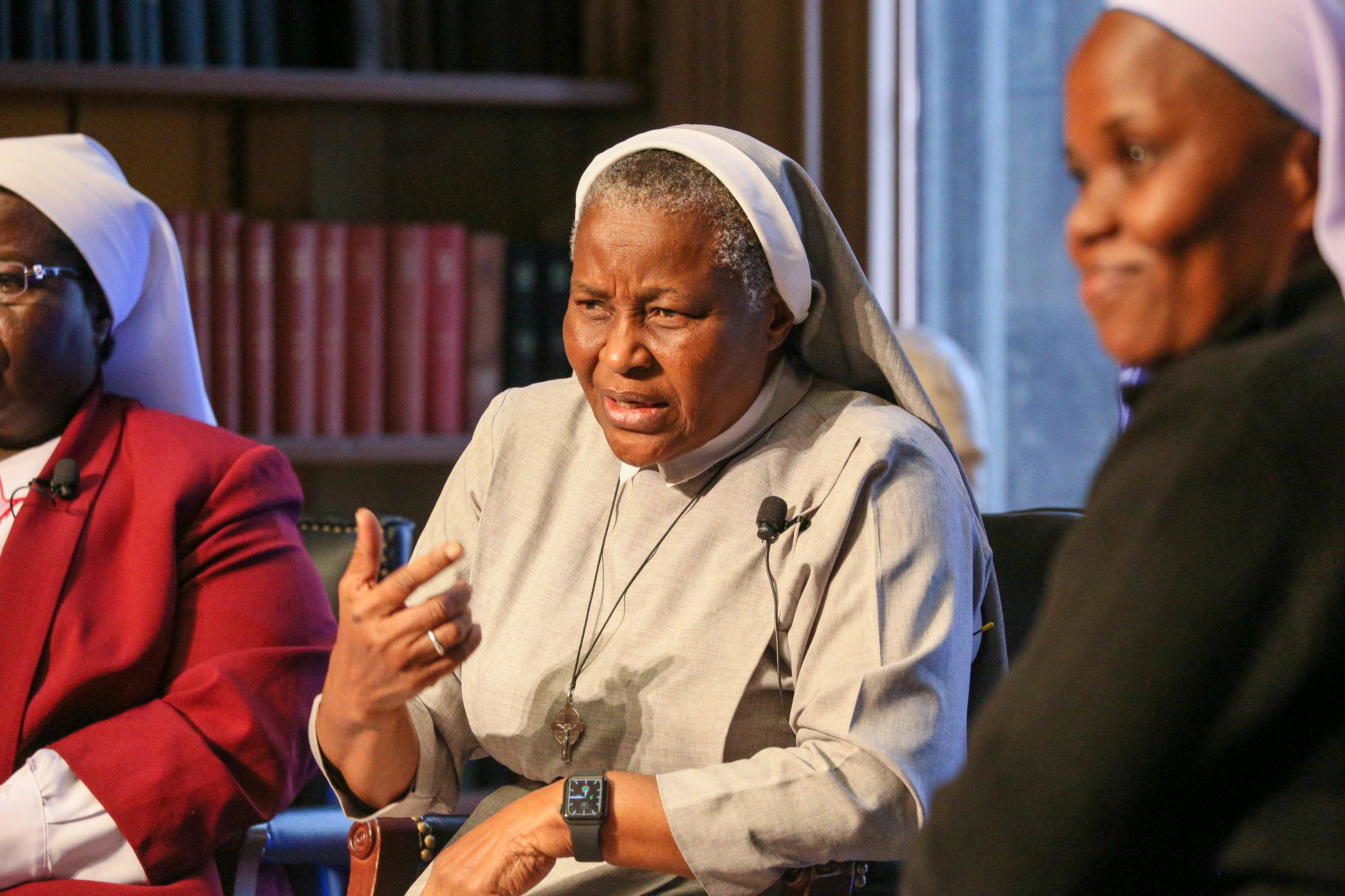 Sr. Francisca Ngozi Uti of Nigeria, center, makes a point during an April 25 forum at Georgetown University. She is flanked by Ugandan Srs. Rosemary Nyirumbe, left,  and Sr. Hedwig Muse. All are participants in the first cohort of the Women in Faith Leadership Fellowship, a jointly-sponsored program whose aim is to raise “the visibility, vitality and voice of Catholic sisters.” (Courtesy of Georgetown University)