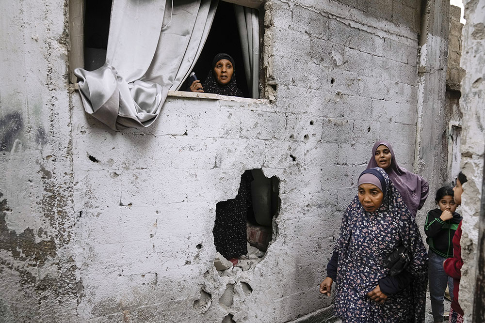 Palestinians inspect the site of an Israeli strike after a military raid in the town of Tulkarem, West Bank, Nov. 22. (AP/Majdi Mohammed)