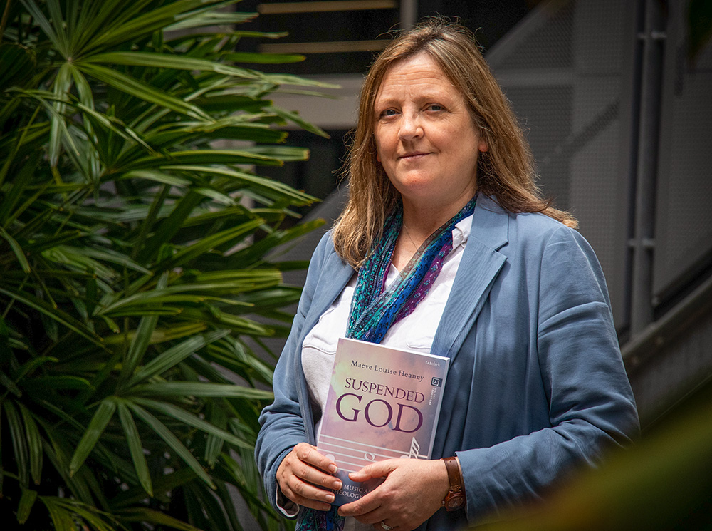Australian Catholic University theologian Sr. Maeve Heaney, Verbum Dei, with a copy of her book Suspended God: Music and a Theology of Doubt (Courtesy of Australian Catholic University)