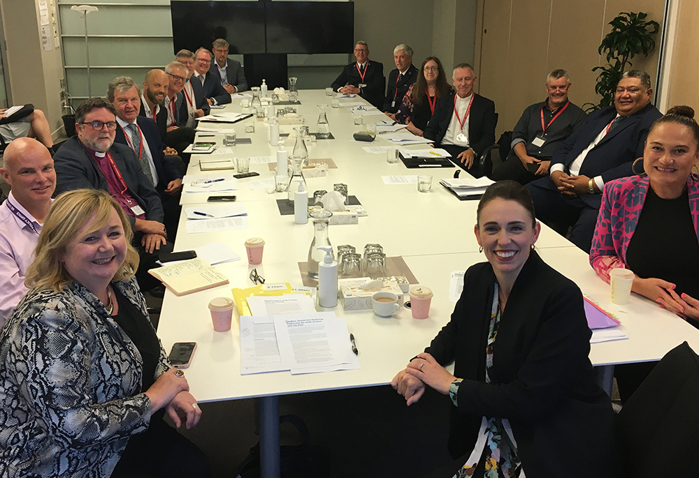 New Zealand Prime Minister Jacinda Arden, front right, poses with church leaders and other officials during a meeting in Auckland March 12, 2021, to talk about COVID-19 vaccines, housing and poverty. New Zealand Cardinal John Dew of Wellington is pictured fourth from right. (CNS/Courtesy of Archdiocese of Wellington)