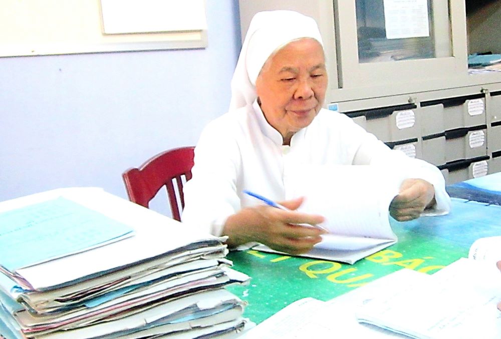 Sr. Josephine Huynh Thi Ly checks the medical records of patients at the Central Hospital in Hue in April 2024.