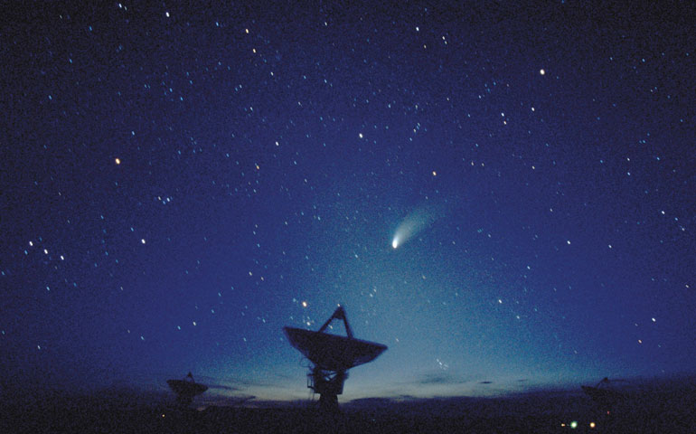 Hale-Bopp comet is seen in the sky above Very Large Array astronomy antennas in New Mexico in 2008.( Newscom/Ray Nelson)