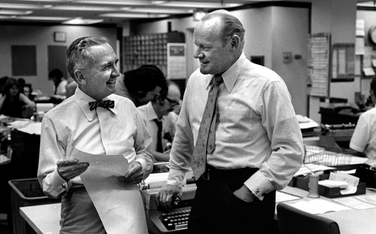 Eugene Patterson, right, talks with St. Petersburg Times publisher Nelson Poynter in the Florida paper’s newsroom in 1974.  (Newscom/ZUMAPRESS.com/St. Petersburg Times/Tamba Bay Times)