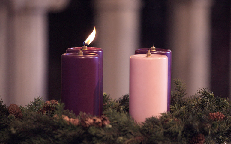 A lit candle in the Advent wreath at St. John Vianney Church in Prince Frederick, Md., marks 2009's first Sunday of Advent. (CNS/Bob Roller)