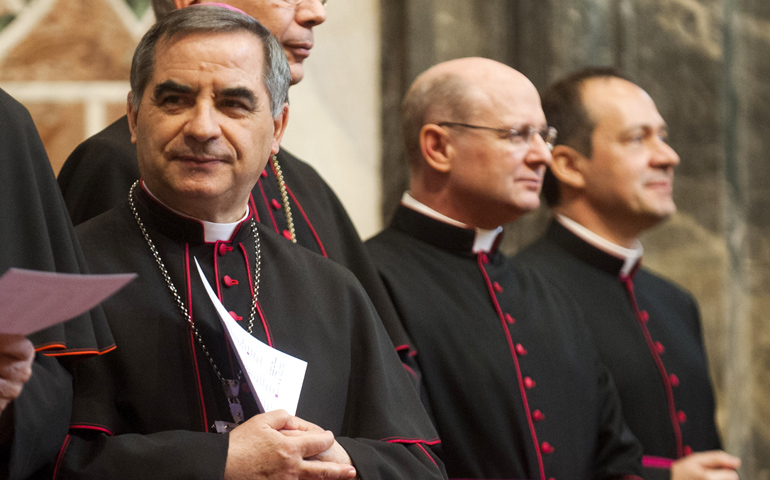 Archbishop Angelo Becciu, left, substitute secretary for general affairs in the Vatican Secretariat of State, at the Vatican on March 22. (CNS/Catholic Press Photo/Alessia Giuliani)