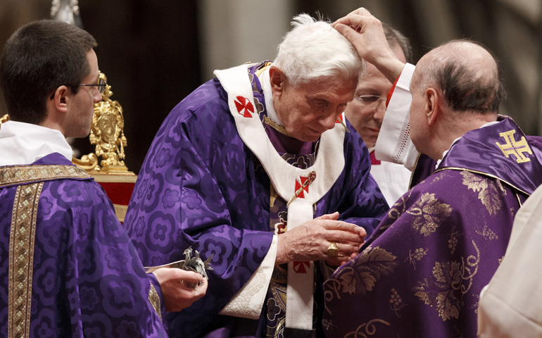 Pope Benedict XVI receives ashes from Cardinal Angelo Comastri, archpriest of St. Peter's Basilica, during Ash Wednesday Mass at the Vatican. (CNS/Paul Haring)