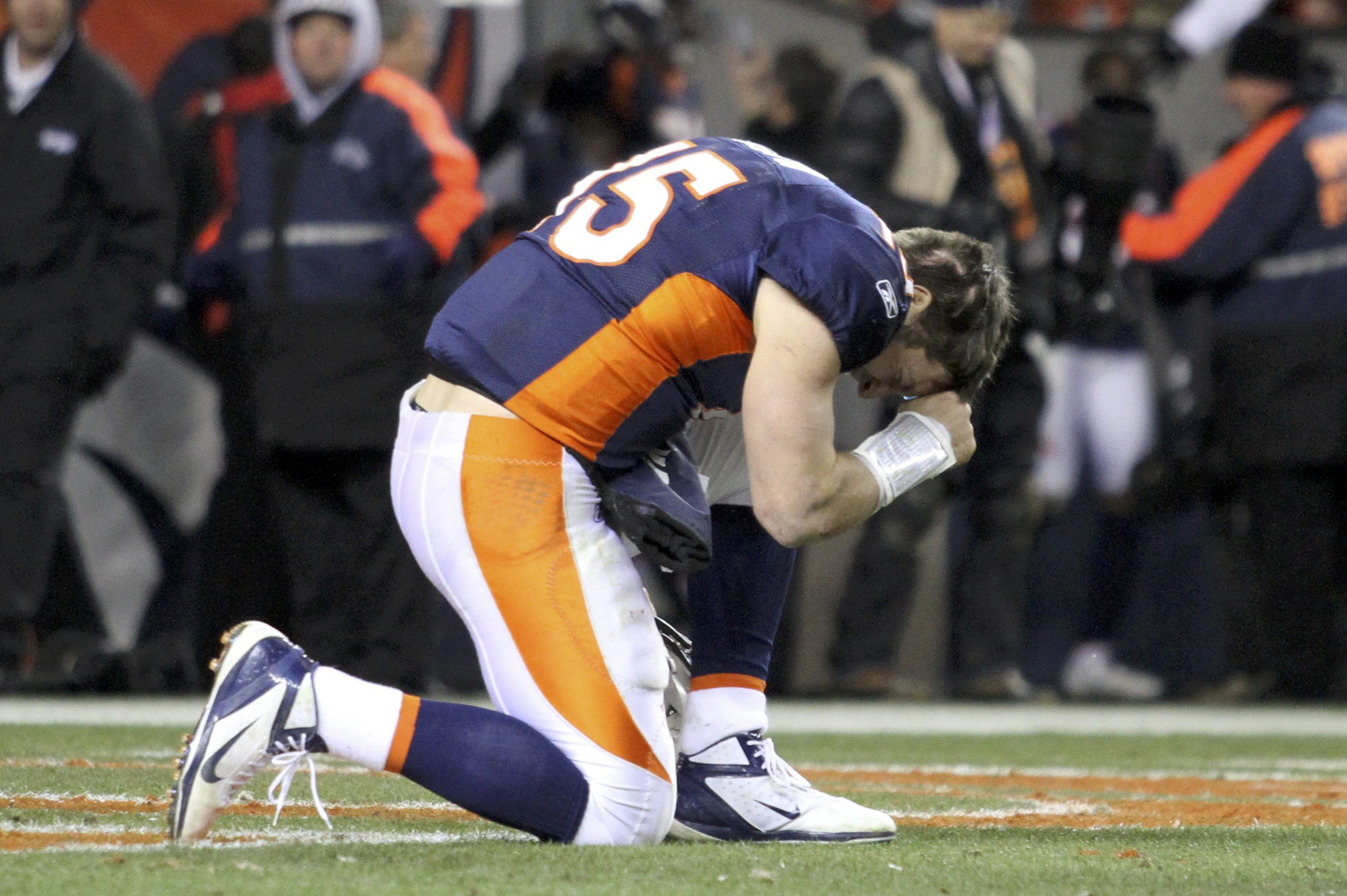 Denver Broncos quarterback Tim Tebow prays after the Broncos defeated the Pittsburgh Steelers in overtime in the National Football League AFC wild-card playoff game in Denver Jan. 8. (CNS/Reuters/Marc Piscotty)