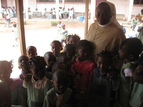 Passionist Sr. Anuarite Ngueugam with some of her preschool students