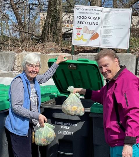 Srs. Cathy Molly and Donna Kelly of the Congregation of Notre Dame, composting at the local food scrap depot in White Plains, New York (Courtesy of Maco Cassetta)