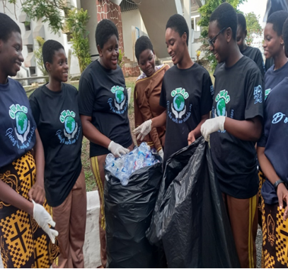 Students from the Holy Child Sisters' school "Global Warming Awareness Club" collect plastic trash in this photo. (Courtesy of Gifty Atampoka Abane)