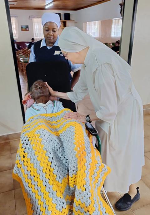 Sister Anthony of Mary tends to sick, elderly people at the convent of the Little Sisters of the Poor in Nairobi, Kenya. (Adelaide Ndilu)