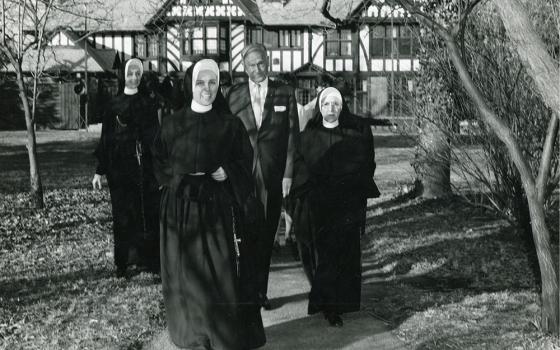 Loretto Sr. Jacqueline Grennan, foreground, and Loretto Sr. Francetta Barberis, far right, walk with Conrad N. Hilton to the groundbreaking for the new theater on the campus of Webster University, then Webster College, in 1966. (Courtesy of Webster University)