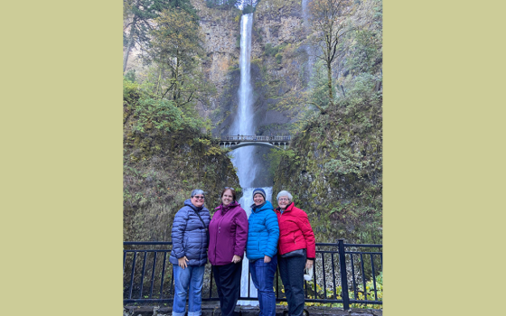Jennifer Wilson and members of the vocation team for the Sisters of Mercy stand at the bottom of the falls before hiking to the top. (Courtesy of Jennifer Wilson)