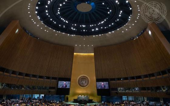 A wide view of the United Nations General Assembly Hall in New York City as Secretary-General António Guterres (on screens) addresses the opening of the 66th session of the Commission on the Status of Women in March 2022. 