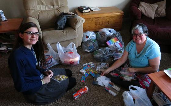 Mercy Sr. Jennifer Wilson and Hope Willert, her student, prepare materials for a service trip to Guayana in March 2017. (Courtesy of Jennifer Wilson) 