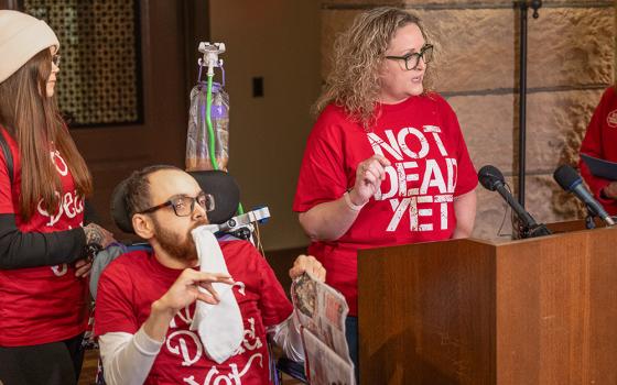 Kathy Ware, right, gives remarks about assisted suicide during a press conference Jan. 25 at the Minnesota Capitol ahead of a state House committee hearing about proposed legislation to legalize physician-assisted suicide in Minnesota. Next to her is her son, Kylen, who has quadriplegic cerebral palsy, epilepsy and autism. (OSV News/The Catholic Spirit/Dave Hrbacek)
