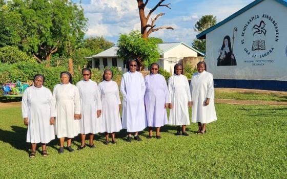 Members of the Missionary Benedictine Sisters of Tutzing stand outside their kindergarten in Kenya's Kerio Valley shortly before they closed their missions in the region. For more than 40 years, the sisters provided medical care, education, and spiritual support to local communities. (Courtesy of Missionary Benedictine Sisters of Tutzing)