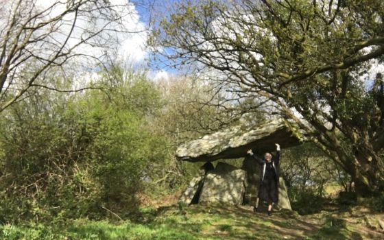 The author at Gaulstown Portal Dolmen, a megalithic portal tomb in County Waterford, Ireland, in April 2021 (Courtesy of Kathryn Press)