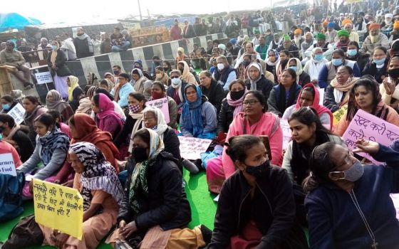 People sit in solidarity with the farmers at the Ghazipur border to India's capital city, Delhi, after new laws were passed in September. (Dorothy Fernandes)