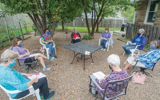 A woman's prayer group offered by Srs. Mary Barbara Wieseler and Elena Mack meets in the backyard of a Sisters of Charity of Leavenworth house in Kansas City, Kansas, during the pandemic. (Sisters of Charity of Leavenworth)
