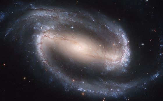 A barred spiral galaxy, seen through the Hubble Space Telescope (NASA)