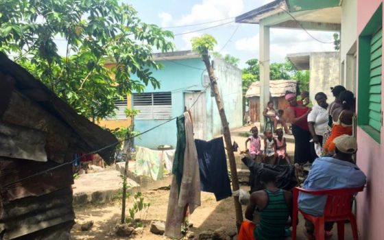 Residents of the Cambalache bateye in Consuelo, Dominican Republic, line up for health screenings. (GSR/Soli Salgado)