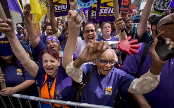 At a July 22, 2015, rally in New York City, people celebrate passage of a recommendation by the New York State Fast Food Wage Board that the minimum wage for fast-food workers be raised to $15 an hour. (CNS/Reuters/Brendan McDermid)