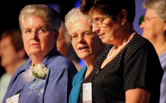 Current LCWR President Sr. Carol Zinn (left), a Sister of St. Joseph, stands with past presidents Franciscan Srs. Florence Deacon and Pat Farrell during the closing Mass at the organization's assembly in St. Louis on Aug. 10, 2012. (CNS photo/Sid Hastings)
