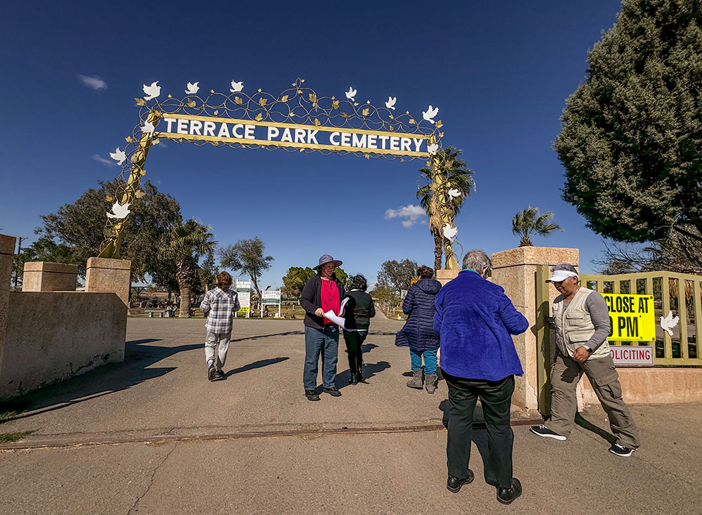 Sisters gather at the entrance of the Terrace Park Cemetery in Holtville, California, Feb. 7, before a procession toward a part of the facility where anonymous migrants are buried. Sisters sang, prayed and threw flowers toward the tombs that are fenced off from the rest of the cemetery. (GSR photo/Rhina Guidos) 