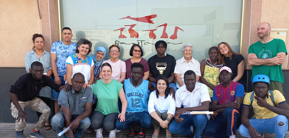 Sr. Fátima Santaló-Osorio, third from left in the top row, with sisters, volunteers, and migrants from the Bantabá Project in Almería, Spain. (Courtesy of Fátima Santaló-Osorio)