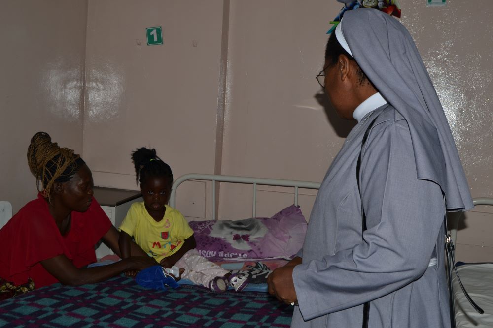 Sr. Marjory Mwansa checks on patients at St. John Paul II Orthopaedic Mission Hospital in Lukasa, Zambia. 
