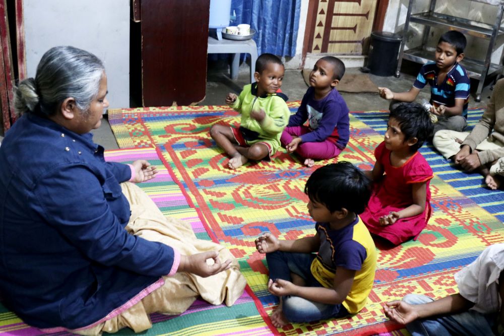 Sr. Monju Maria Corraya meditates with children in the drop-in center at central Dhaka, Bangladesh. 