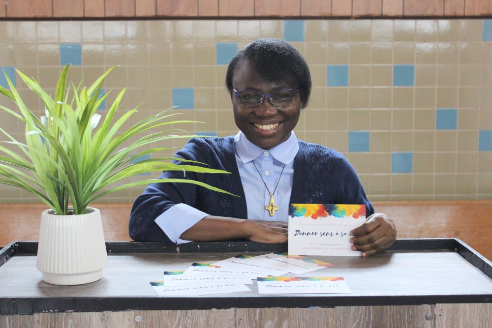 Sr. Joséphine Kimbolo distributes these colorful promotion cards to people she meets. 