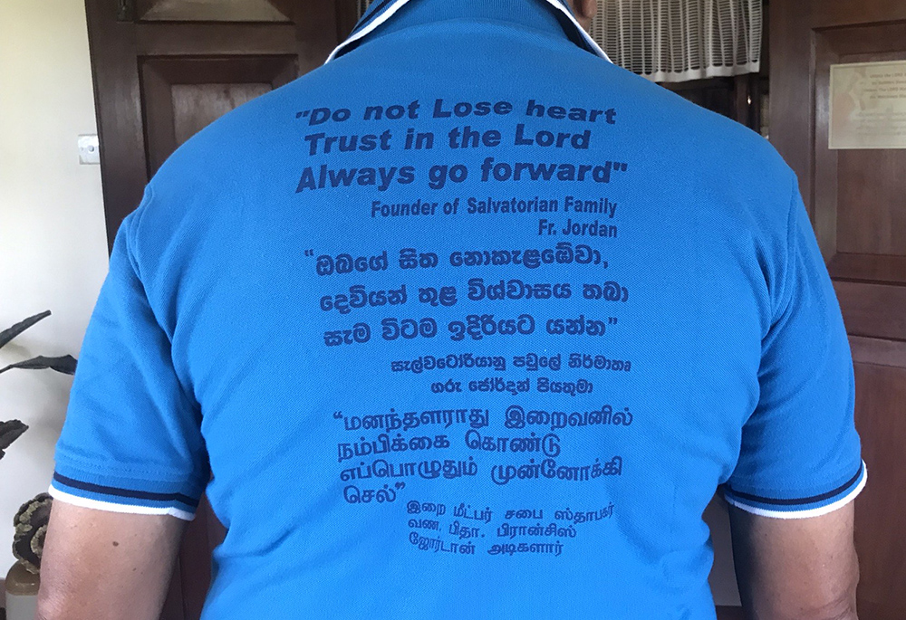 A slogan from the founder of the Salvatorians, Fr. Francis Mary of the Cross Jordan, is printed on the back of T-shirts worn by the Lay Salvatorians in Sri Lanka. (Thomas Scaria)