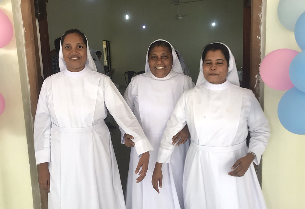 Salvatorian provincial Sr. Shiroma Kurumbalapitiya, center, is pictured with the two nuns who made their final profession on April 6 at their provincial house in Kurunegala, Sri Lanka. (Thomas Scaria)