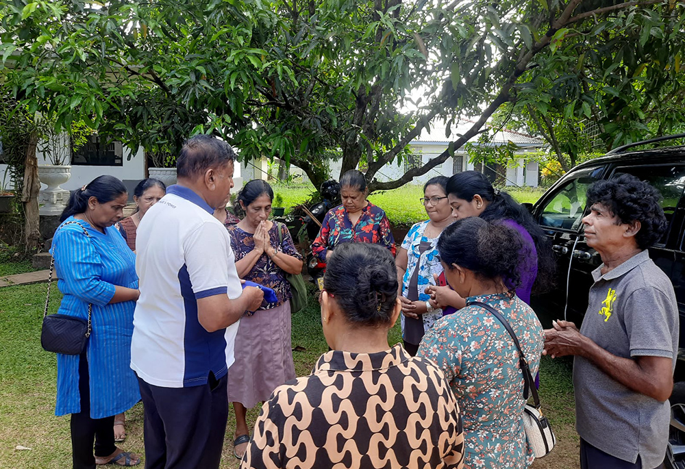 Lay Salvatorians pray together before leaving to serve cancer patients at the Teaching Hospital in the Kurunegala region of Sri Lanka. (Courtesy of Renuka Damayanthi)