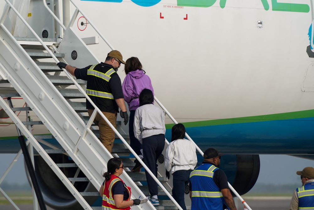 Colombian women board a repatriation flight to their country, in Harlingen, Texas, Feb.  28. 