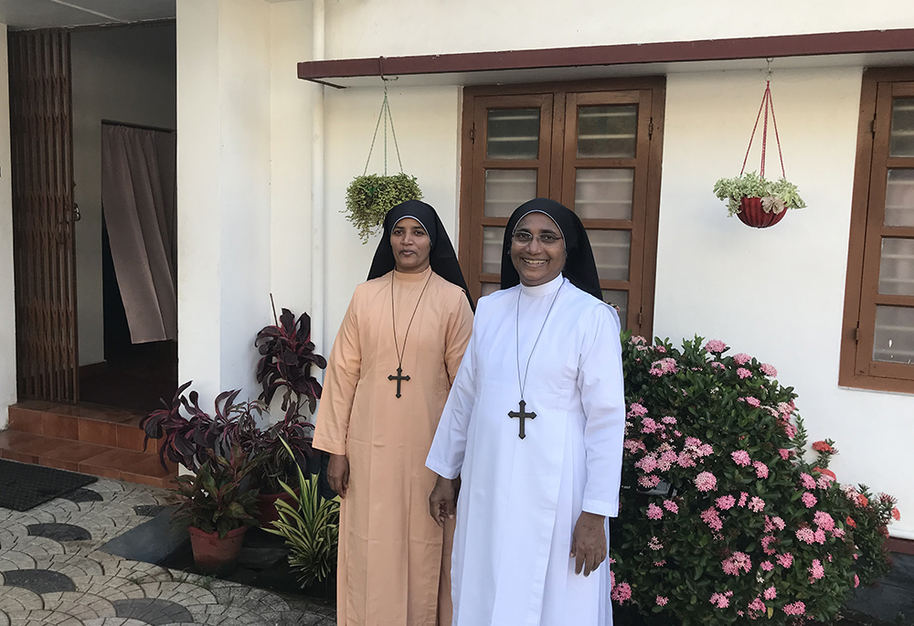 Sr. Ardra Kuzhinapurathu, right, and Sr. Shalini Tharayil, members of the Sisters of the Imitation of Christ, are pictured in front of the generalate in Kottayam, central Kerala. (GSR photo/Thomas Scaria)