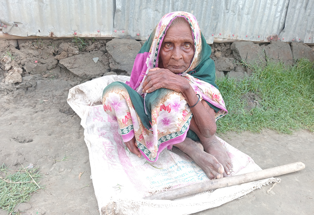 Haju Halder, 77, struggles to walk. During the storms, her relatives carried her to a secure place. (GSR photo/Sumon Corraya)