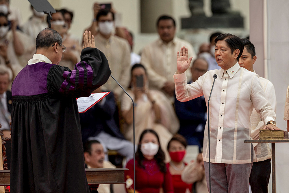 Ferdinand "Bongbong" Marcos Jr., the son and namesake of the late dictator Ferdinand Marcos, takes the oath as the 17th president of the Philippines during the inauguration ceremony at the National Museum in Manila June 30, 2022. (CNS/Reuters/Eloisa Lopez)
