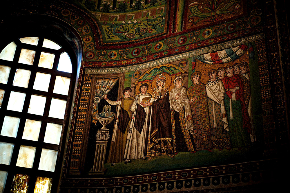A mosaic of the liturgical procession of Theodora and her imperial court located at the Church of San Vitale, in northwestern Ravenna, Italy. (Wikimedia Commons/O0OKO0o)