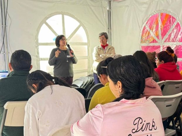 Social Service Sr. Elizabeth Lopez, left, talks to a group of migrants at the Cobina Posada del Migrante shelter in Mexicali, Mexico, Feb. 8. Lopez, an immigration attorney, tries to inform asylum-seekers of what the U.S. asks for when granting asylum. (GSR photo/Rhina Guidos)