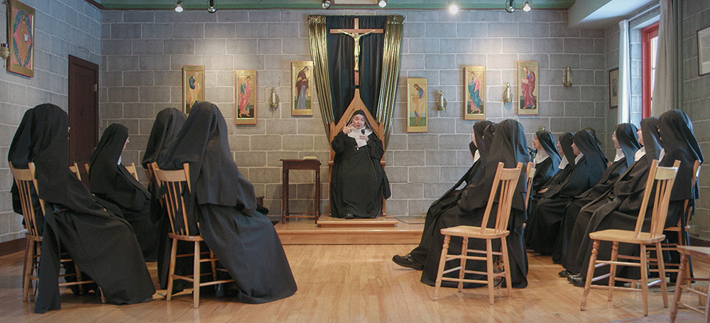 In a still image from the documentary "De l'autre côté" ("On the Other Side"), the Benedictine nuns listen during a conference by Mother Abbess Isabelle Thouin in the chapter house of the Abbey of Sainte-Marie des Deux-Montagnes in Sainte-Marthe-sur-le-Lac, Quebec. (Courtesy of Lessandro Sócrates)
