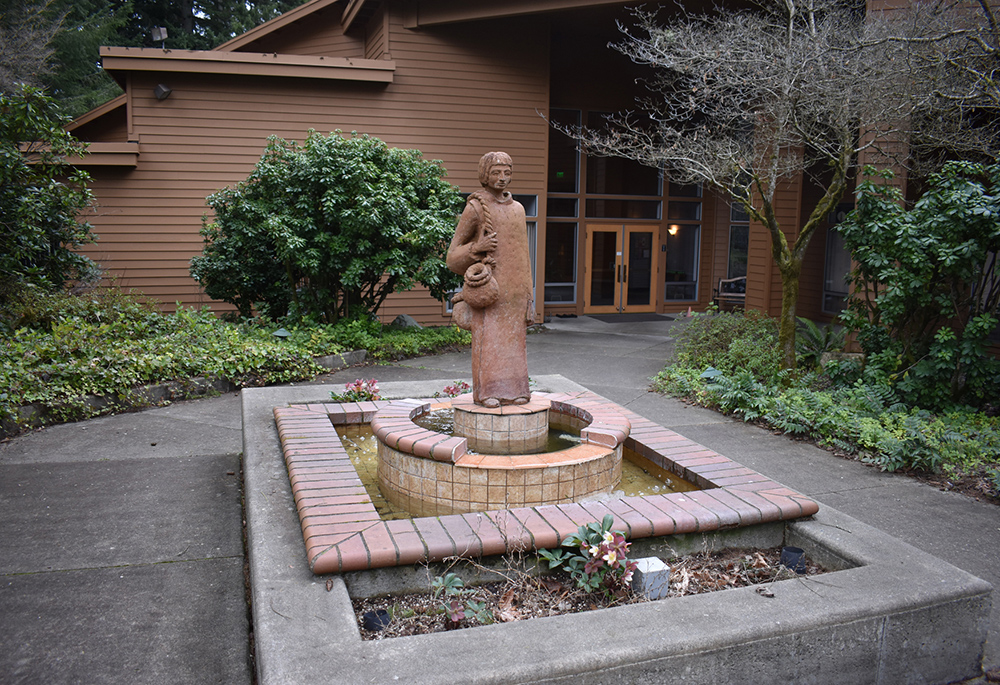 A statue of St. Placid welcomes visitors and guests at the entrance of St. Placid Priory, Lacey, Washington. (Julie A. Ferraro)