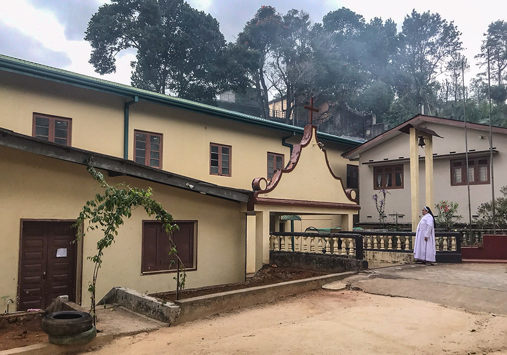 Apostolic Carmel Sr. Maria Amali at the entrance of her nearly 100-year-old convent at Pussellawa, Sri Lanka (Thomas Scaria)