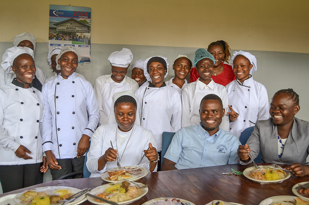Hotel management students display the snacks they prepared during practical lessons at the Auxilium Skills Training Center in Makeni, Lusaka, Zambia. (GSR photo/Derrick Silimina)