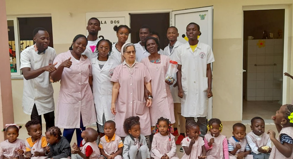 The local community holds a farewell party for Sr. Maria João Prudência (center) before she leaves Benguela, Angola. (Courtesy of Our Lady of Fatima's Sisters of Reparation)