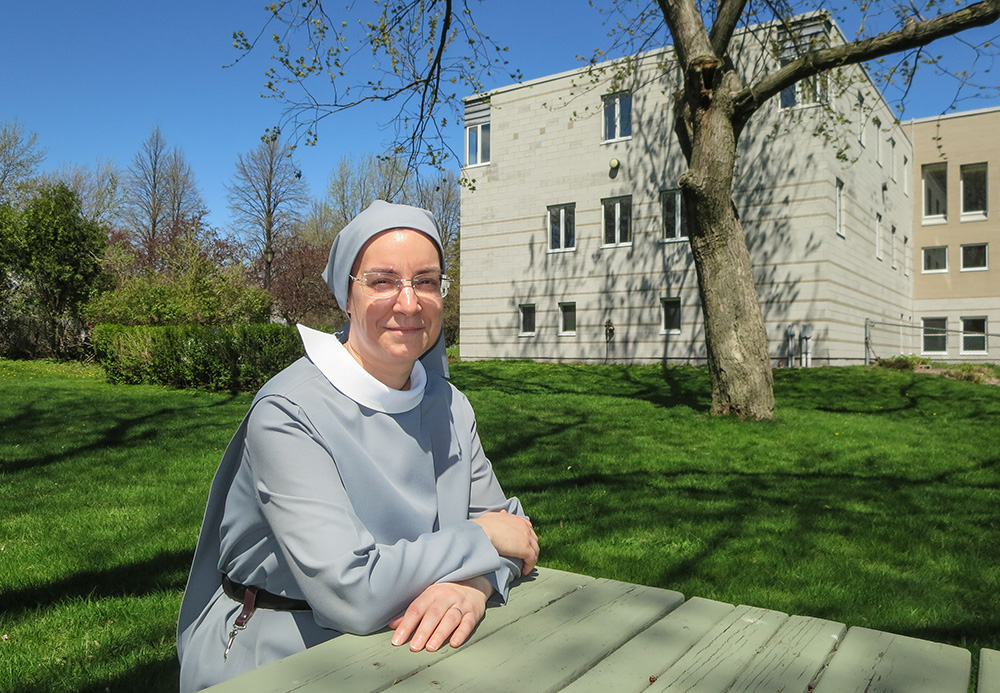 Sr. Ginette Généreux sits in the backyard of the Recluse Sisters' Montreal monastery. (Joanna Kozakiewicz)